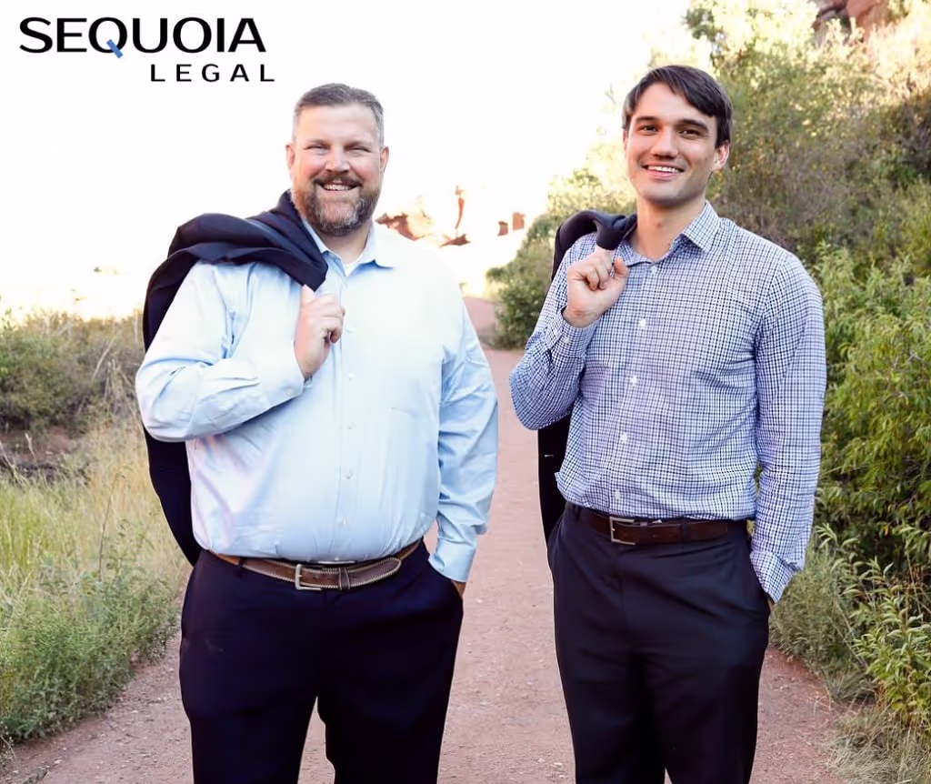 Two smiling men on an outdoor trail next to the Sequoia Legal logo