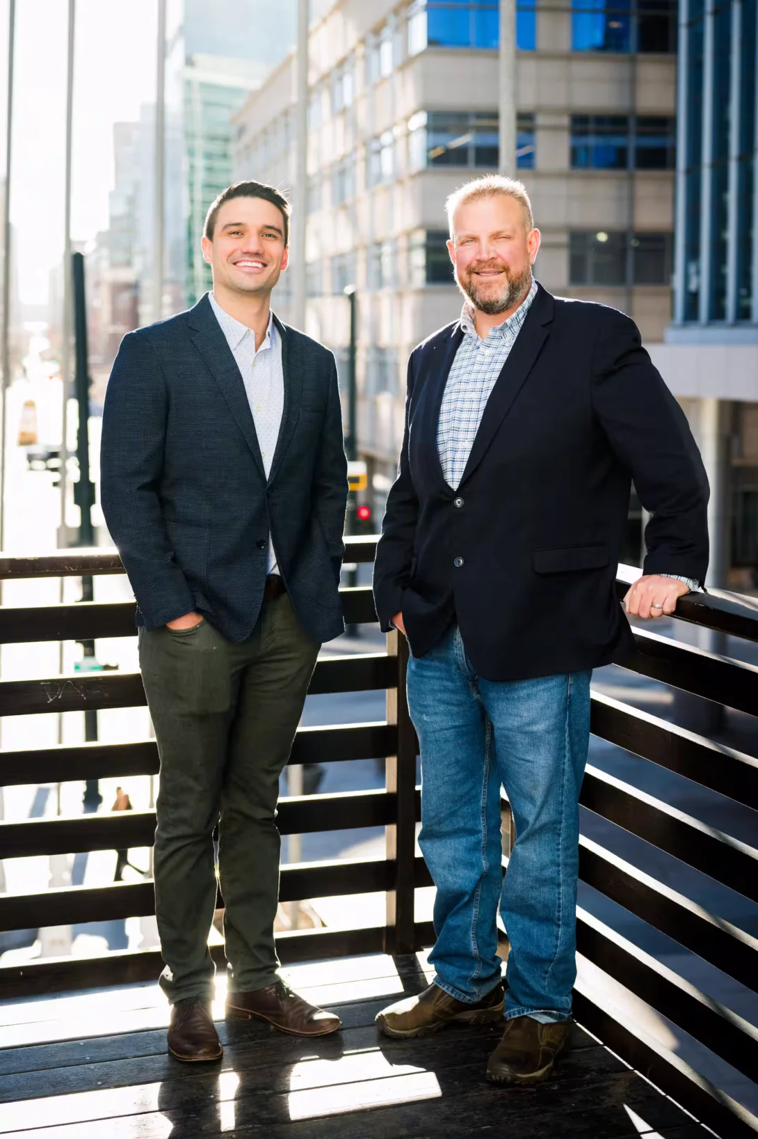 Hunter Boone and Andrew Lopez on a city balcony