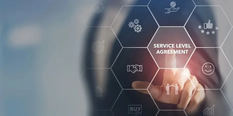 Hand touching a "Service Level Agreement" icon surrounded by business symbols