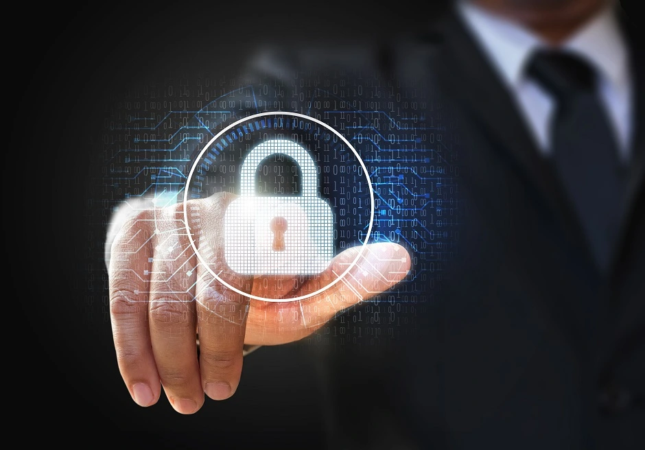 Hand touching a glowing padlock icon on a digital security interface