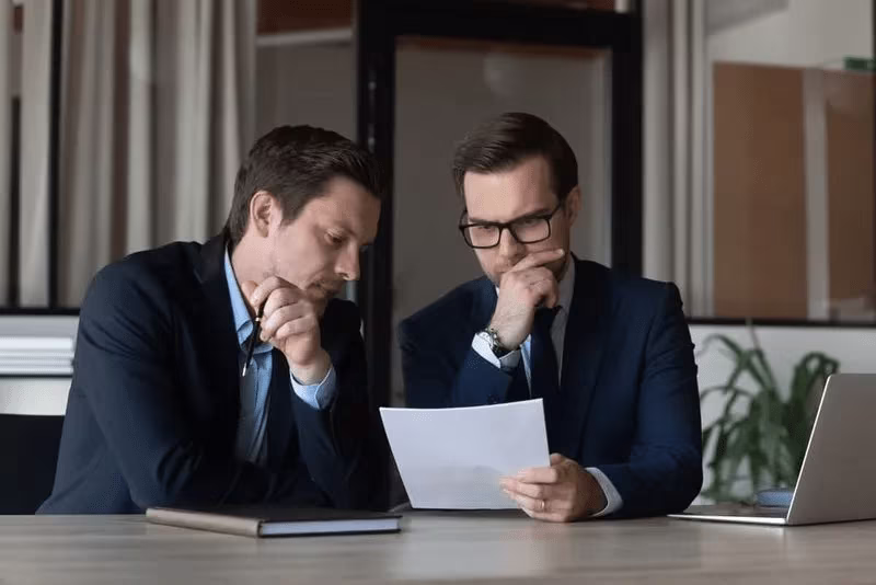A couple of people discuss documents